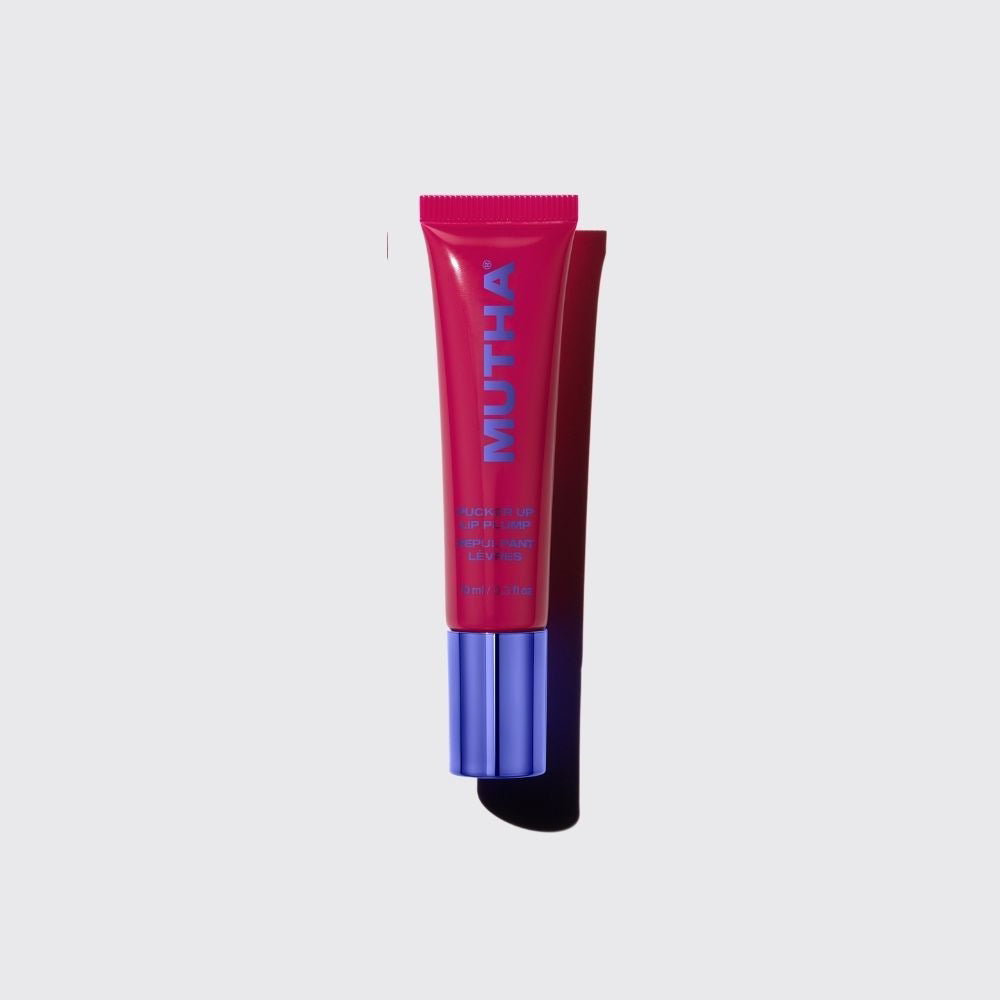 MUTHA Pucker Up Lip Plump Talk Cherry To Me tube standing upright on a light background with a purple cap.